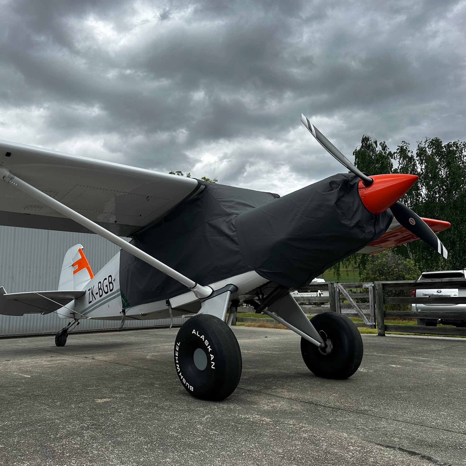 Bearhawk-aircraft-outside-hangar-fron-on-grey-aerosewcover-on