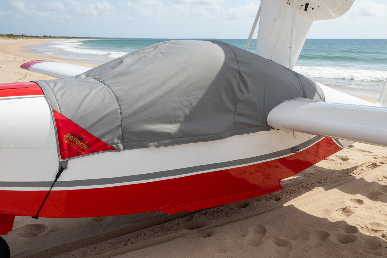 Lake_amphibian-aircraft-on-golden-beach-with-grey-aerosew-cover-on