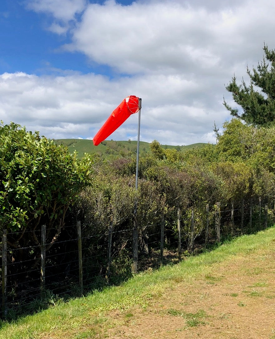 Windsock-in-hedge-over-rolling-country