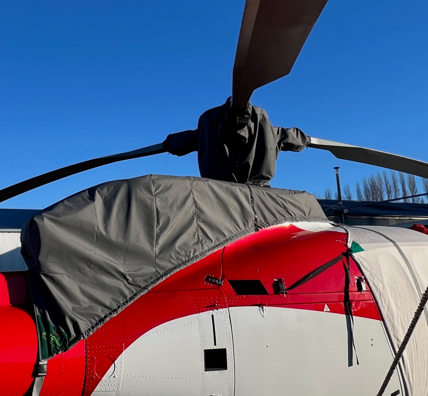 Aerosew rotor head and engine transmission cover fitted to a Squirrel AS350 beside a grey bubble cover