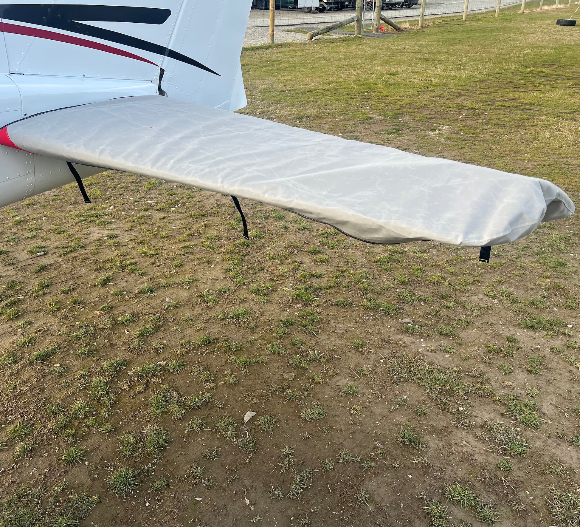 Full-length Cessna 172 horizontal tailplane cover with securing straps fitted over the stabiliser and elevator