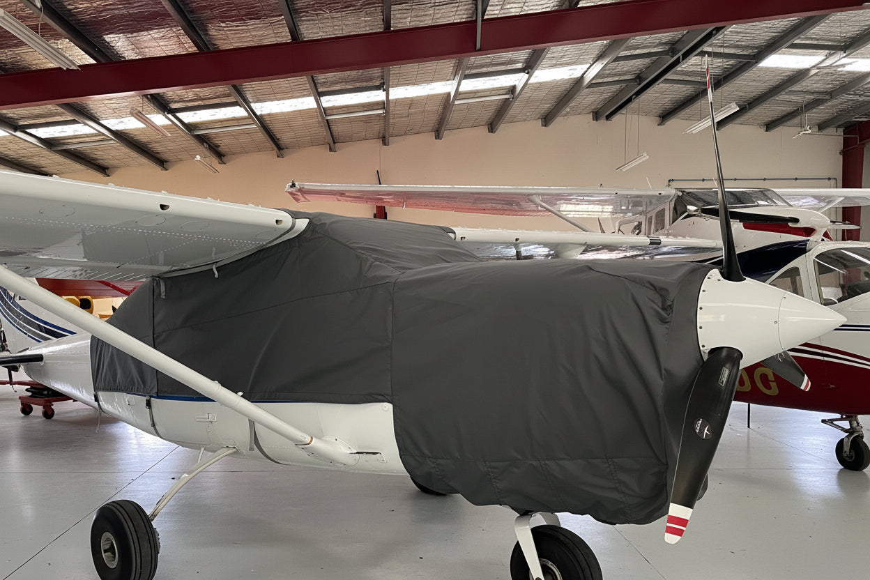 Cessna c206 aircraft with aerosew cover on in hangar 