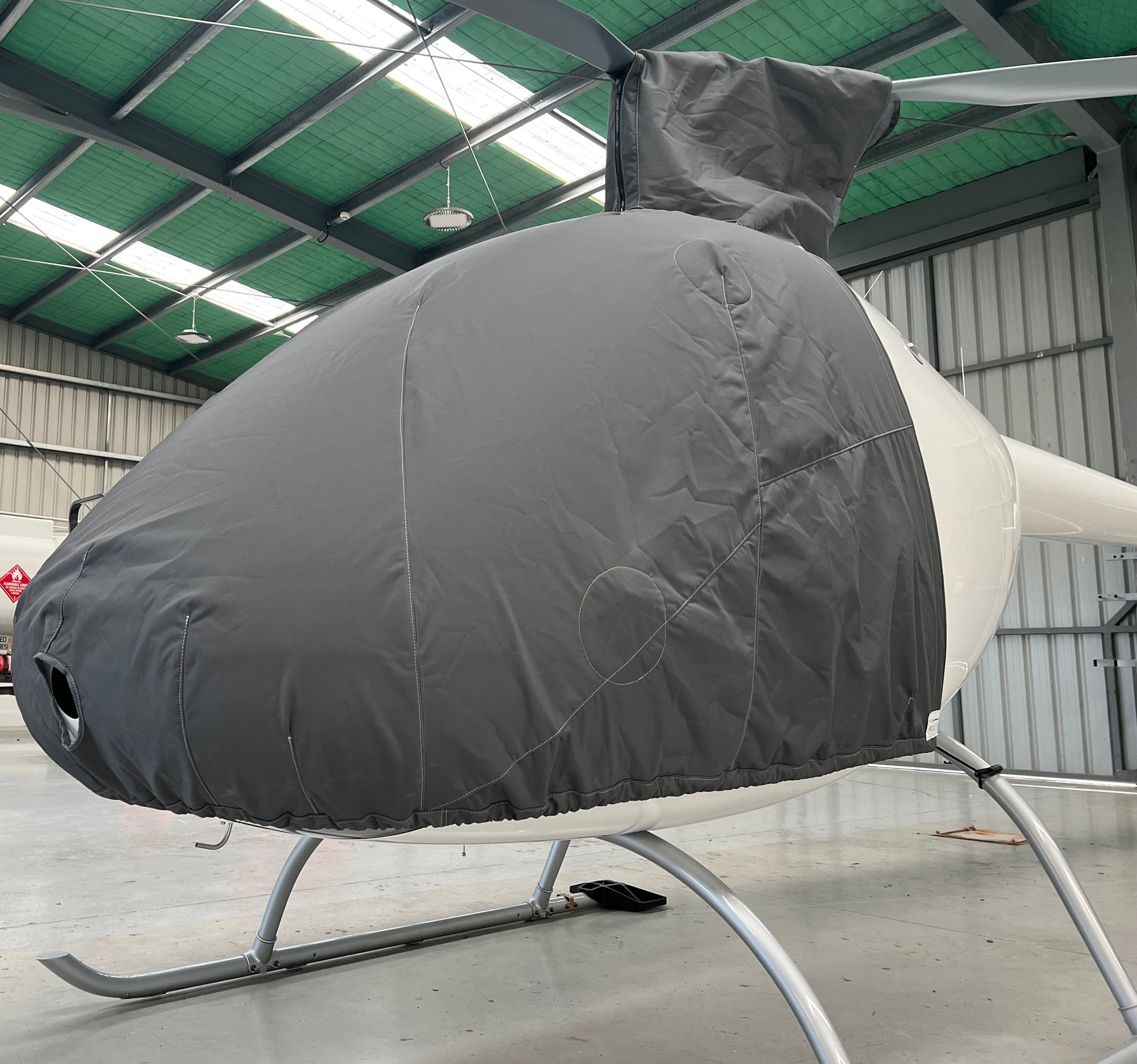 cabri-with-grey-aerosew-cover-on-in-hangar