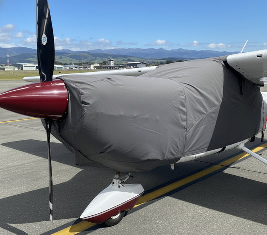 cessna c177 Airplane with a gray aerosew cover over it on a white background