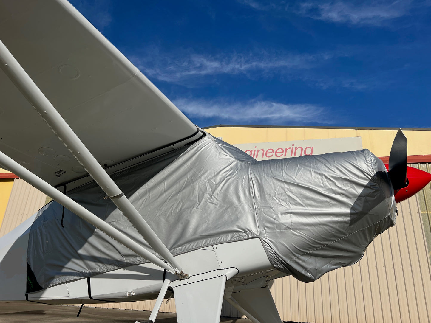 piper-pacer-outside-hangar-with-silver-aerosew-cover